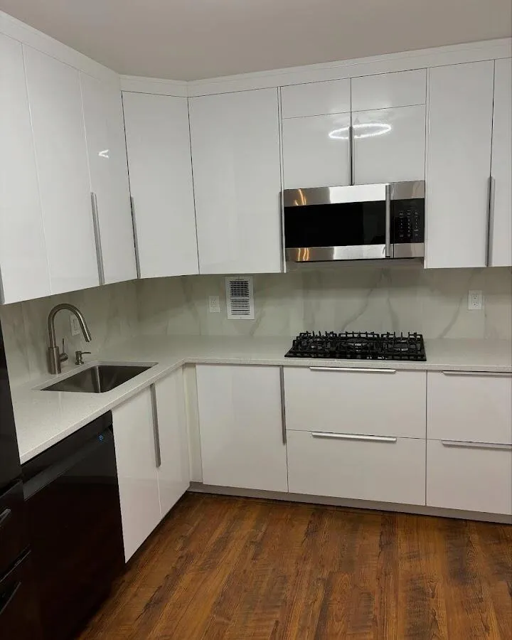 Restored kitchen with white cabinets after water damage in Westtown